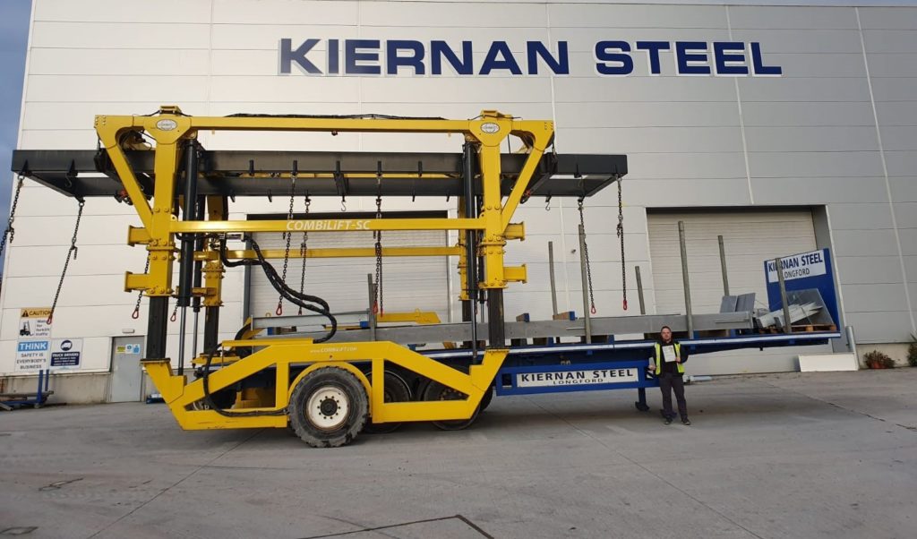 Combilift Straddle Carrier lifting and transporting steel beams for Kiernan Steel