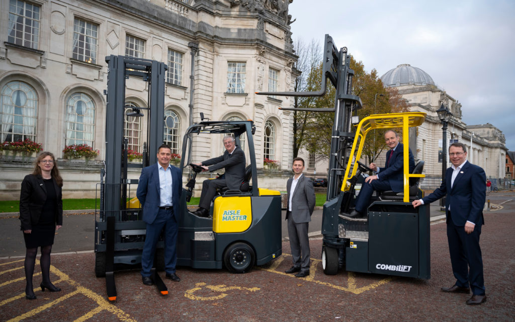 Taoiseach, Michéal Martin T.D. and First Minister of Wales Mark Drakeford sit in two seperate Combilift machines, the Combi-C Series and Aislemaster.