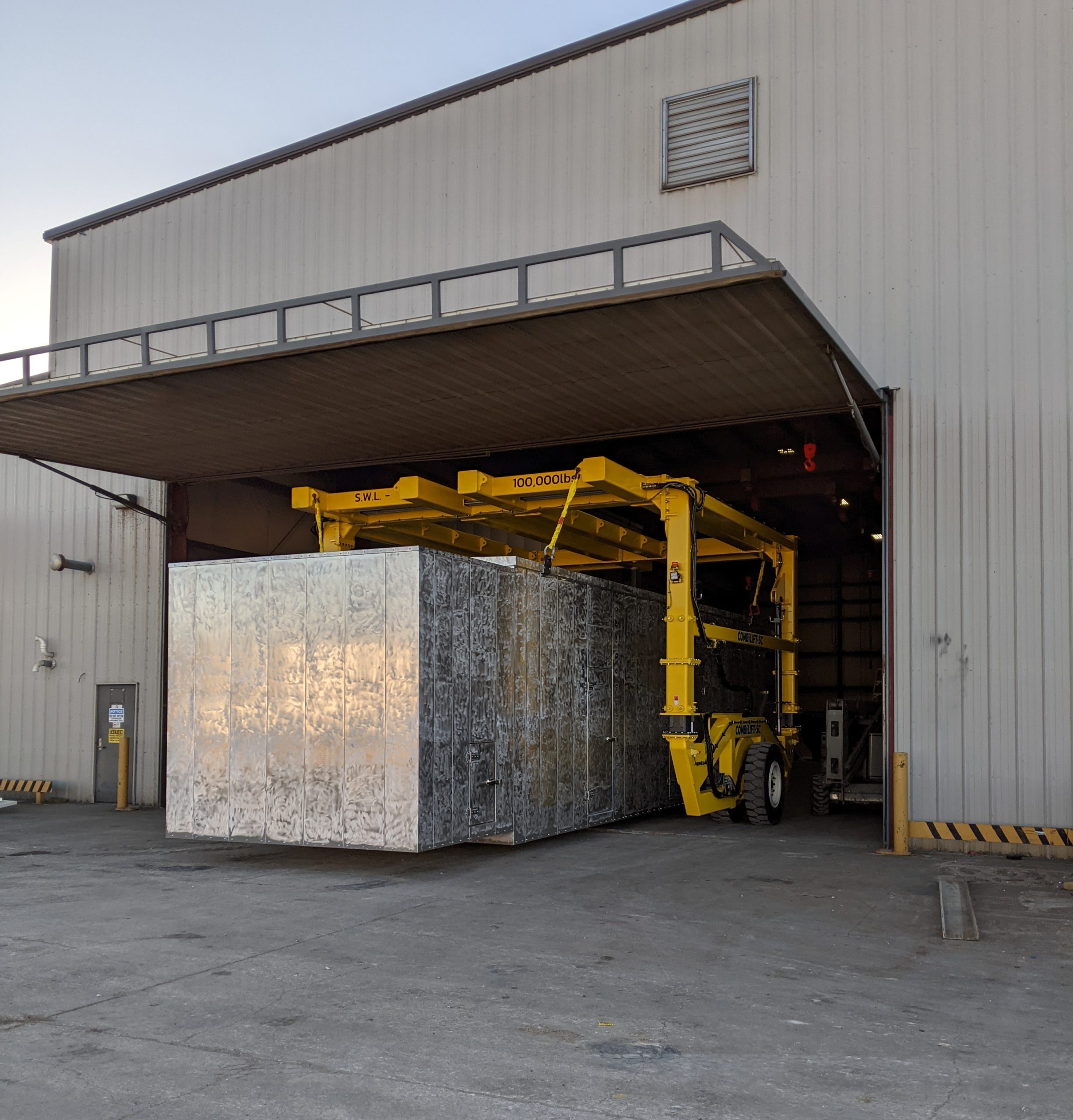 Straddle Carrier Transporting under Low Doorways